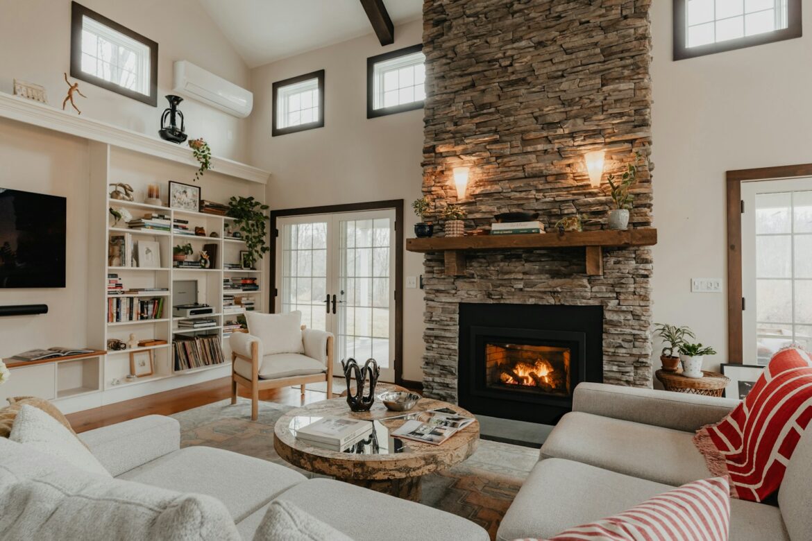 a living room filled with furniture and a fire place